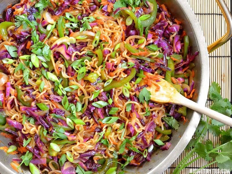 Top view of a skillet of vegetable stir fry with noodles 