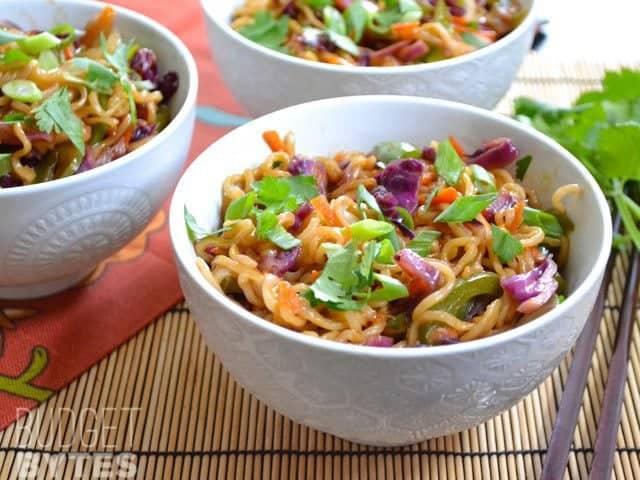 Close up of a bowl of vegetable stir fry with noodles 