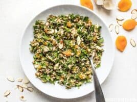 This Parsley Salad with Almonds and Apricots is savory, sweet, crunchy, and drenched in a tangy homemade vinaigrette! Holds up well to refrigeration and perfect for meal prep! Budgetbytes.com