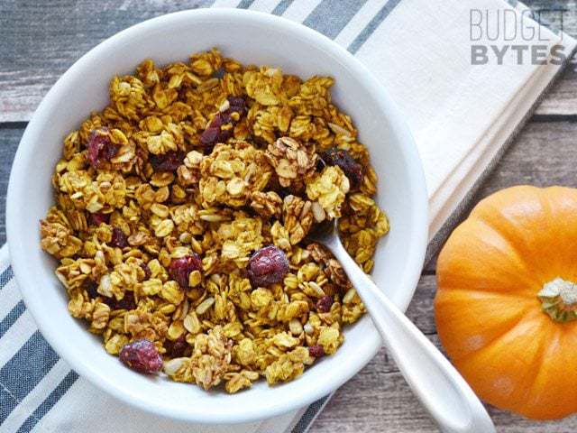 A bowl of pumpkin granola with nuts and seeds.