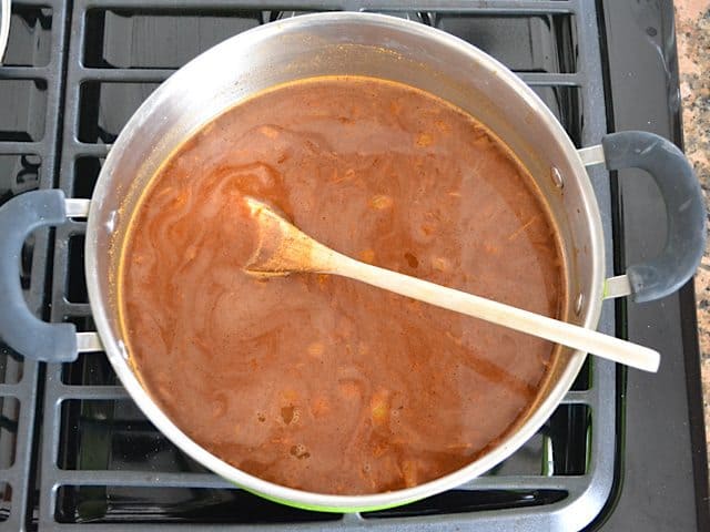 Vegetable Broth and Tomato Paste added to pot with other ingredients 