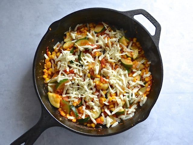 Shredded Monterrey Jack cheese sprinkled over sautéed veggies 