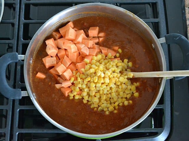 Cubed Sweet Potatoes and corn added to pot with other ingredients 