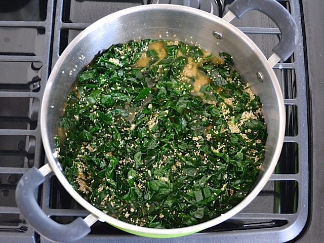 Quinoa and Broth added to other ingredients in pot 