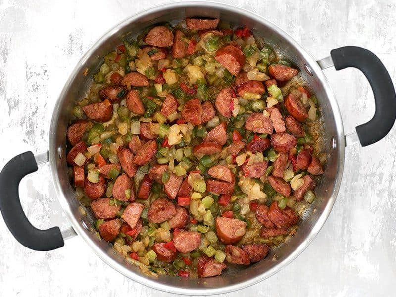 Garlic and Seasoning Mix in the pot with the sausage