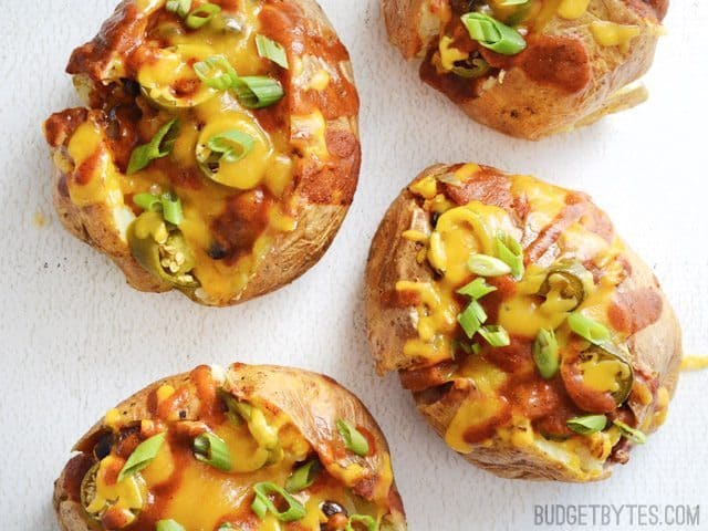 A close-up of nacho taters topped with cheese and jalapeños.