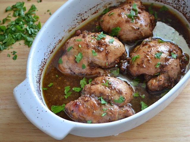 Parsley sprinkled over top of chicken thighs 