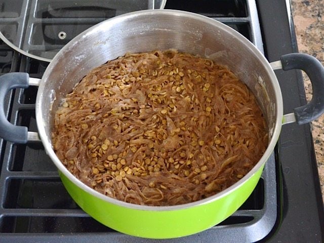 Cooked Mujaddara in pot on stove top 