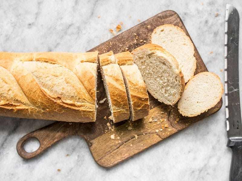 Sliced French Bread on a wooden cutting board