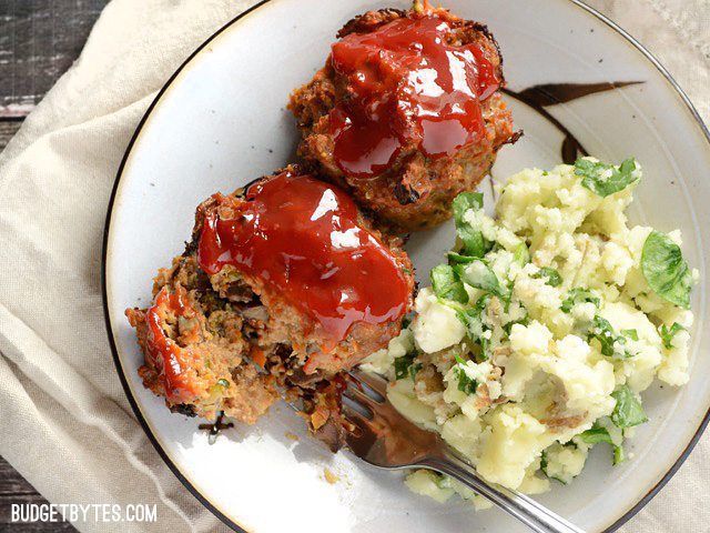 Two Mini Garden Turkey Loaves on a plate with a side of potatoes 