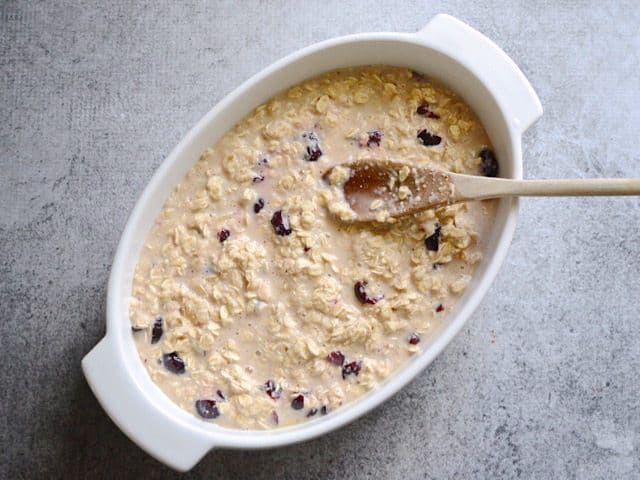 Mixture poured into casserole dish and spread out with wooden spoon 