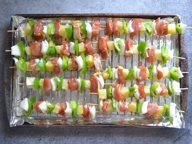 Filled Skewers on wire racks on top of sheet pan