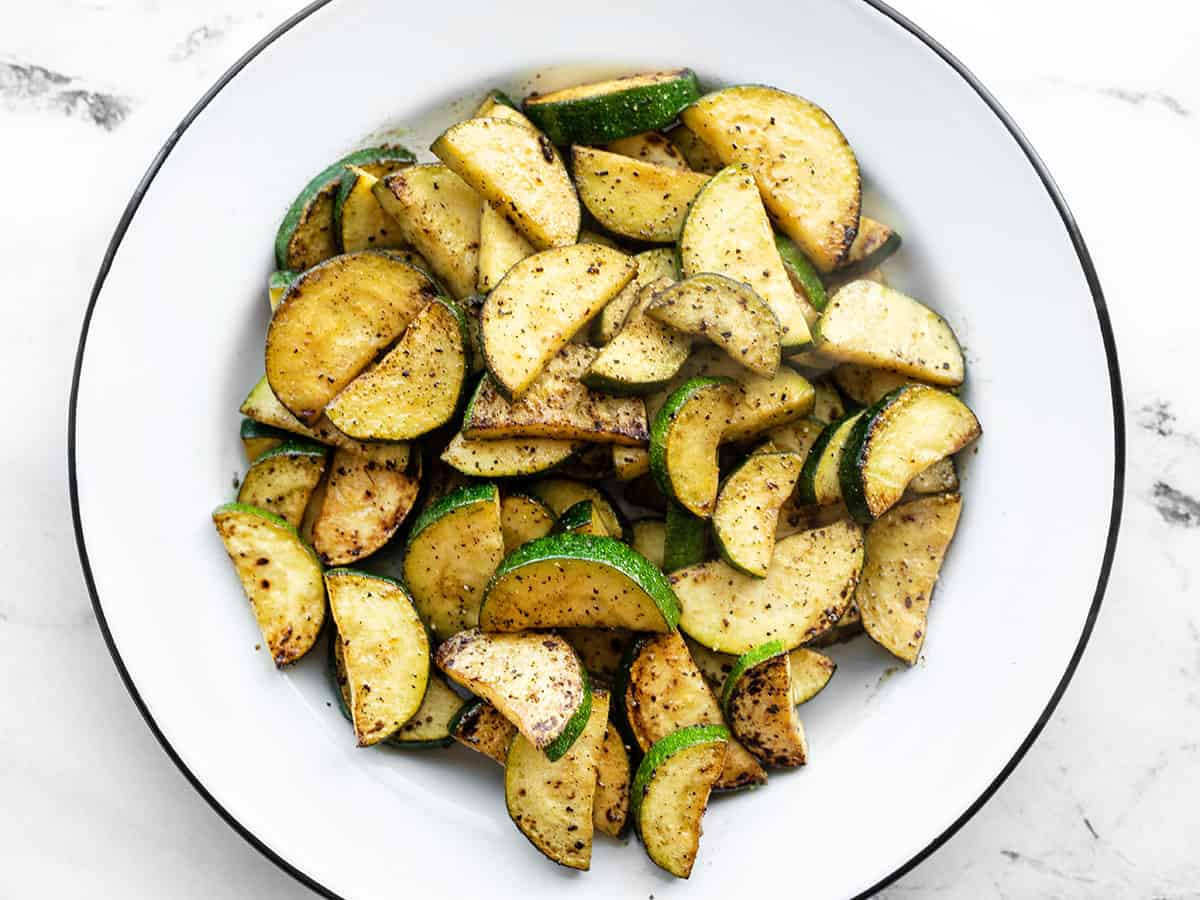 Overhead view of a bowl full of lemon pepper zucchini