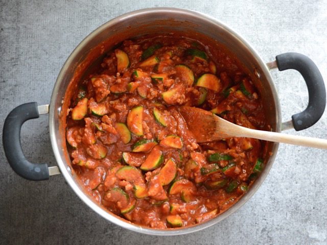 Pasta sauce added to the pot