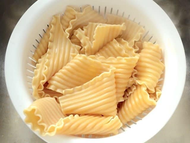 Boiled Lasagna Noodles draining in a colander