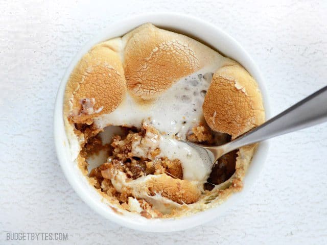 Close up of one Peanut Butter S'mores Pots with a spoon digging in