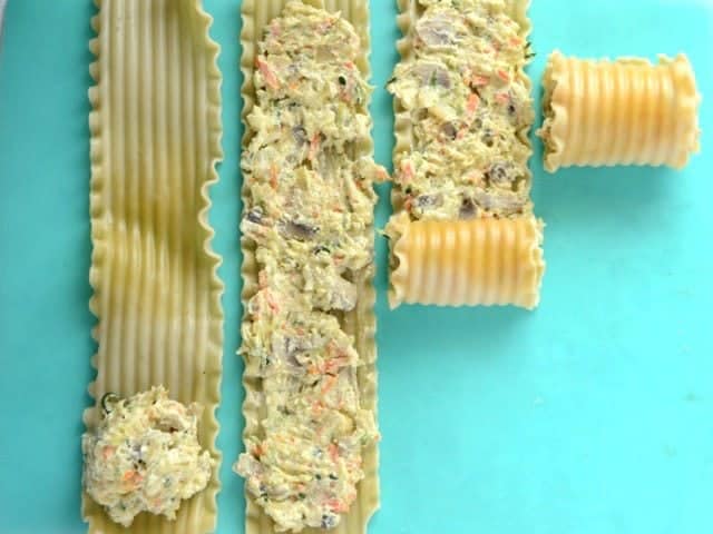 Cheese and vegetable mixture spread onto lasagna noodles