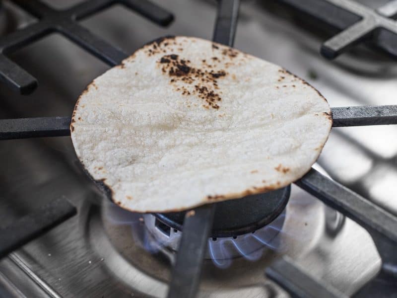 Toast Tortillas on open flame