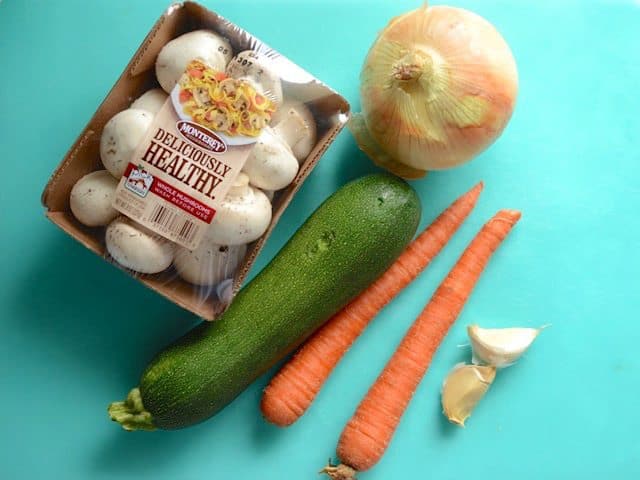 Whole vegetables on a cutting board