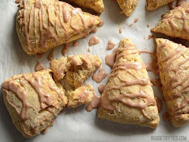 A plate of apple pie scones topped with crumble.