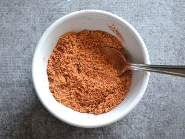 Smoky Parmesan spice mix in a bowl with a spoon