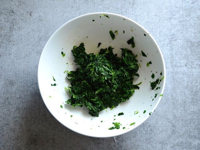 Squeeze Dried Spinach in a bowl