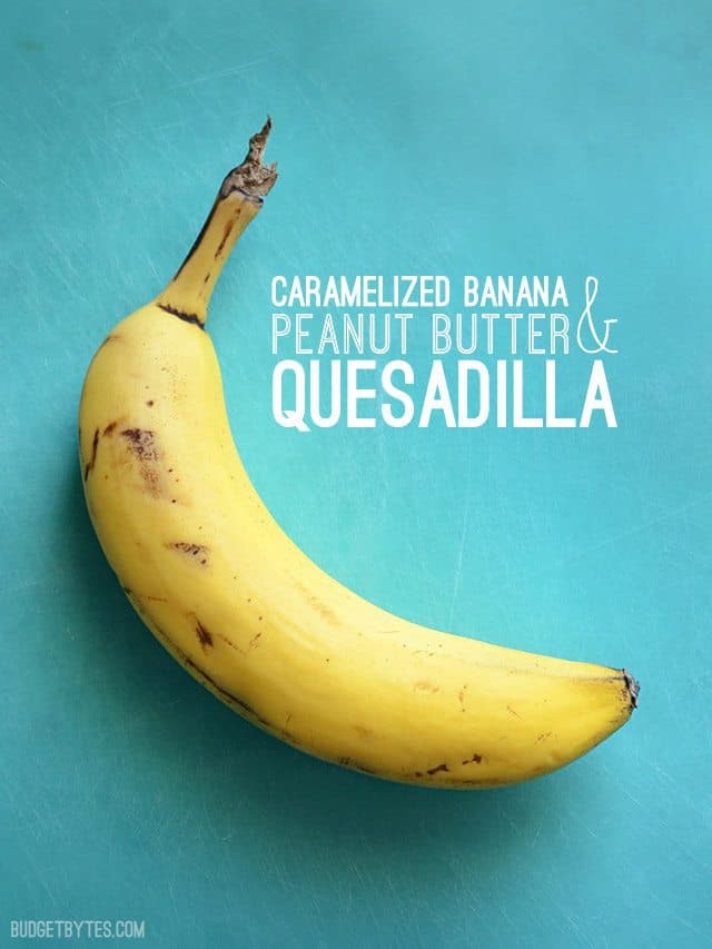 One brown banana on a blue cutting board, title text next to the banana