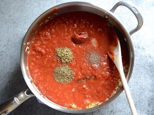 Tomatoes and Spices added to the skillet