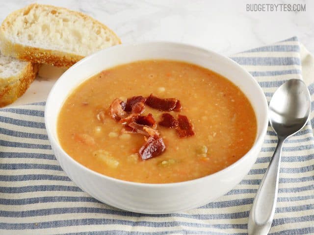 A hearty bowl of bean, bacon, and potato soup.