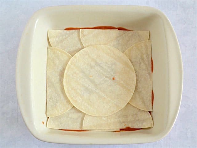 Layer 2 Tortillas on top of enchilada sauce