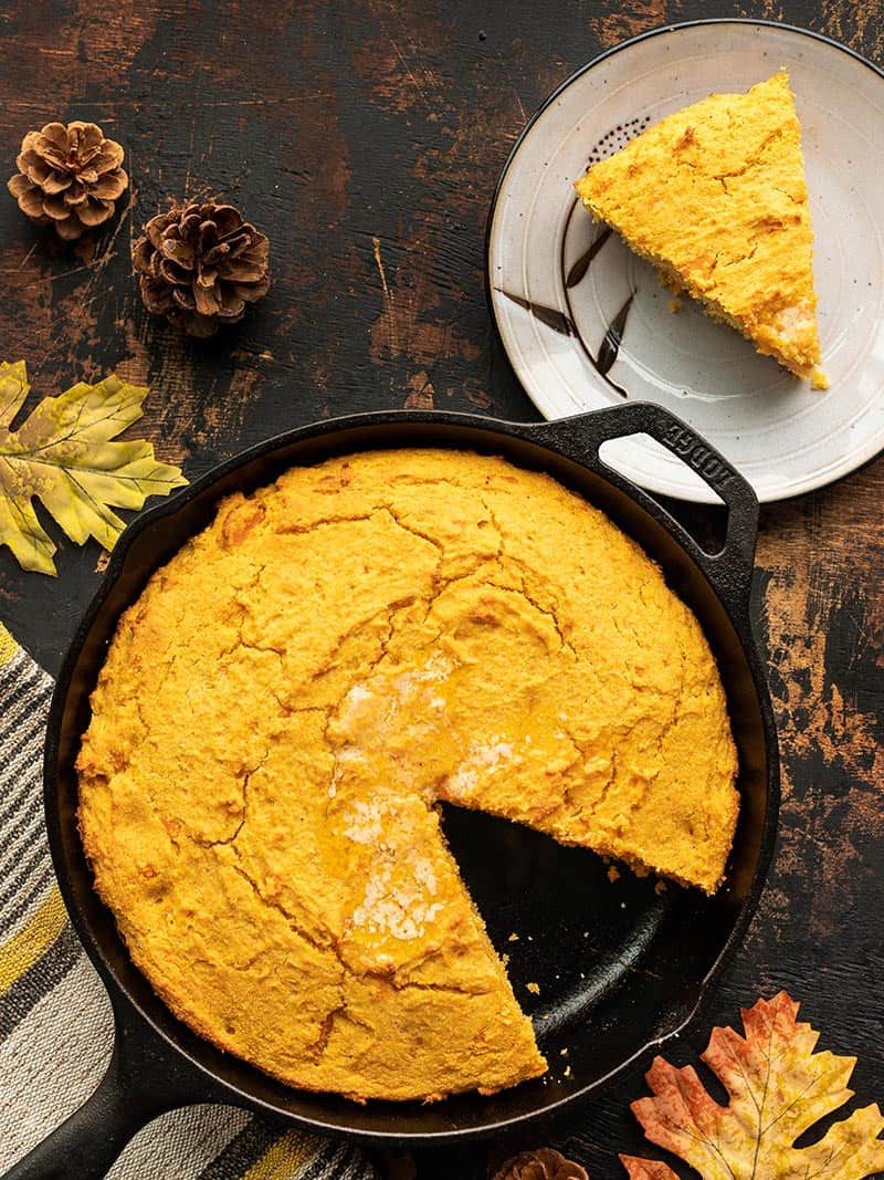 Sweet potato cornbread with one sliced removed and on a plate on the side