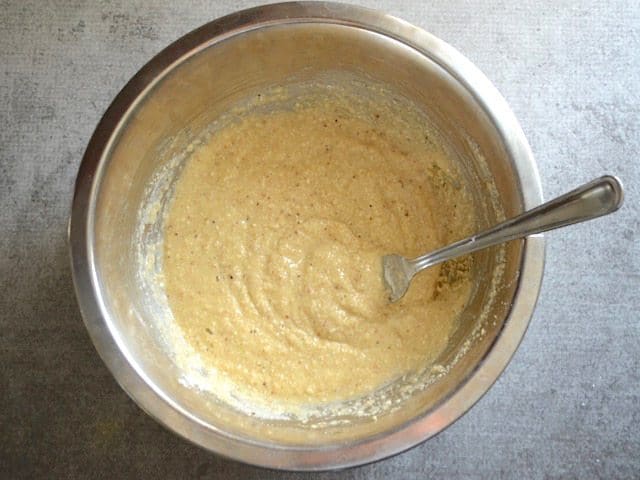 Matza meal added to other ingredients in mixing bowl 