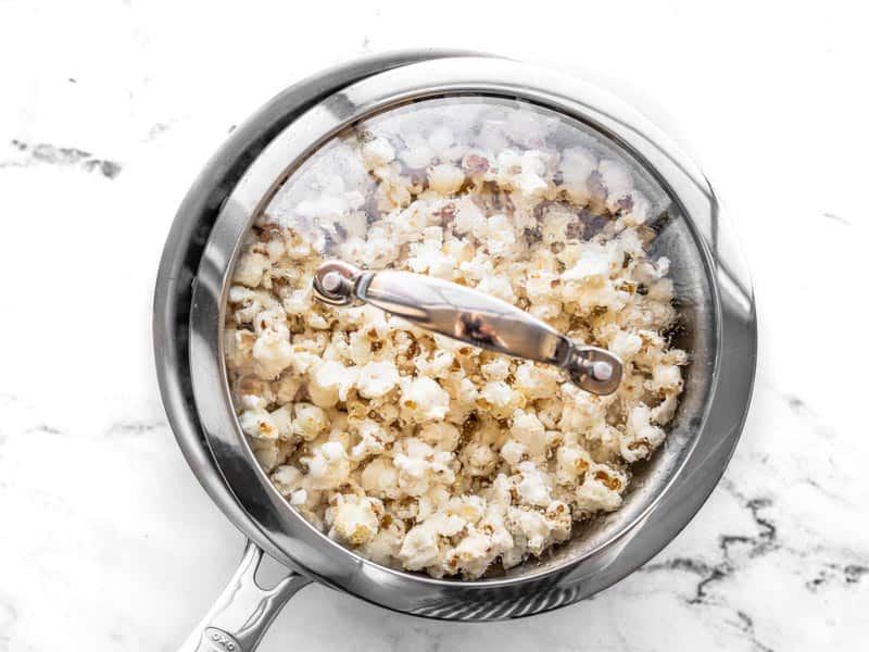 Cracked lid on pot full of popcorn