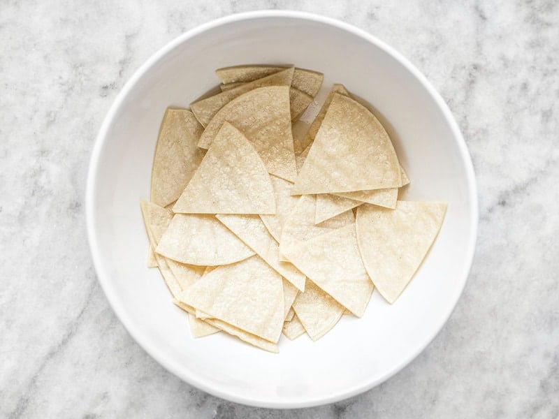 Coat Tortillas in Oil by tossing in a bowl