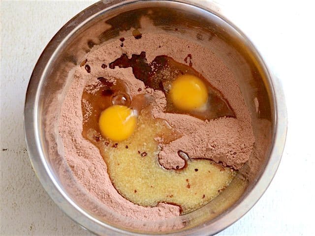 Eggs, Butter, and Vanilla added to dry ingredients in the bowl