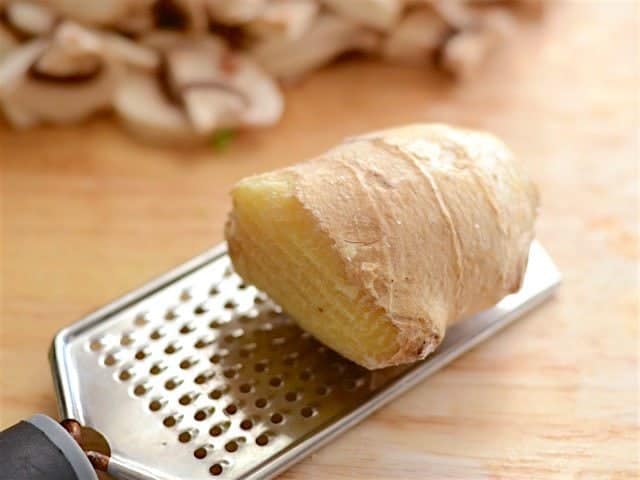 Knob of ginger on a grater