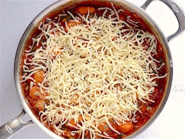 Skillet topped with mozzarella