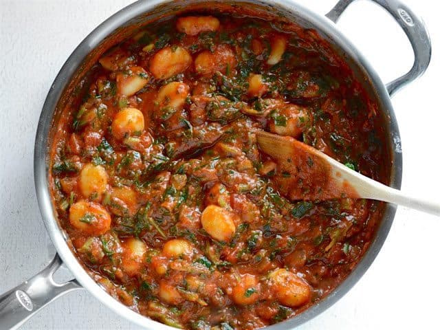 Sauce and Greens Warmed through with gnocchi in the skillet