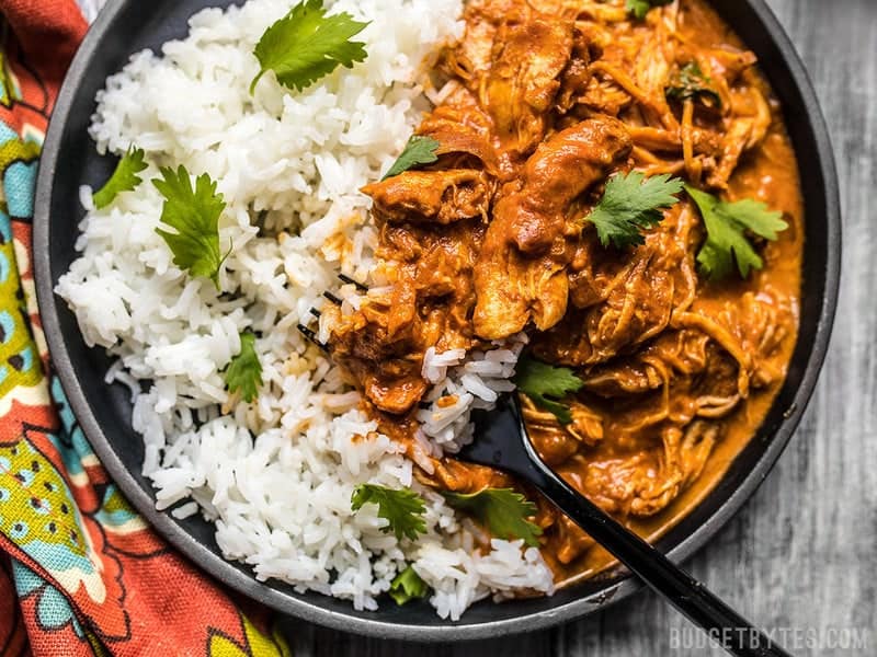 Close up view of Slow Cooker Chicken Tikka Masala on a plate with rice. 