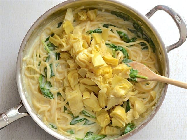 Chopped Artichoke Hearts added to the skillet