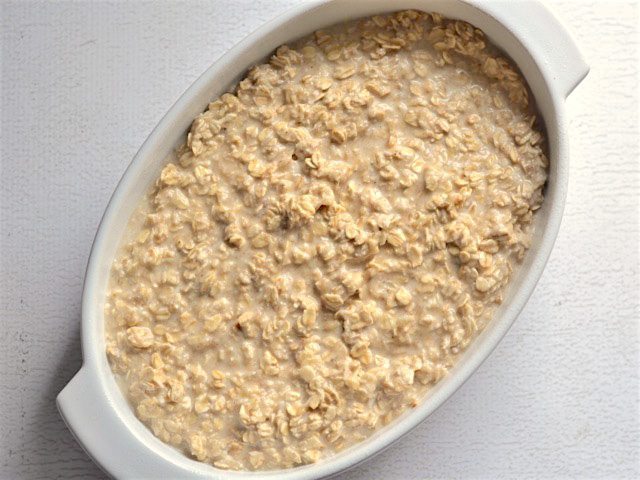 Oatmeal mixture in the casserole dish ready to bake