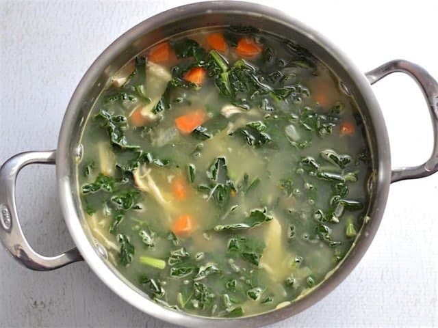 Chicken Broth and Herbs added to the soup pot