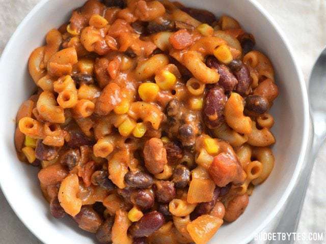 Close-up of cheesy vegetarian chili mac in a bowl.