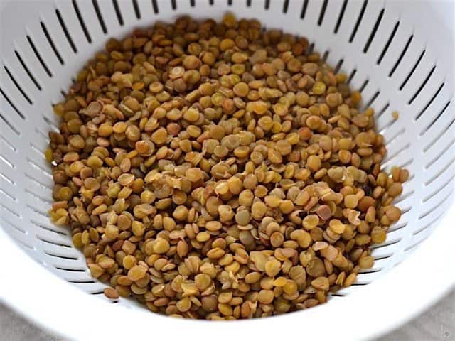 Cooked Lentils draining in a colander