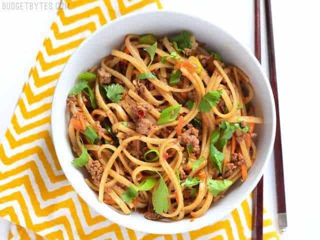 Stir-fry beef noodles served in a bowl.