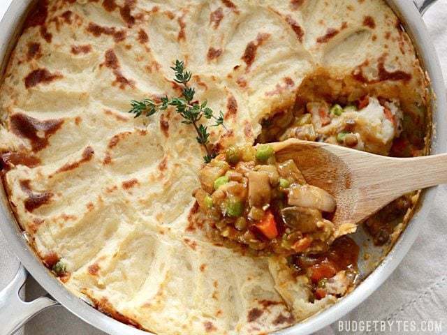 Vegetarian shepherd's pie served with a scoop.