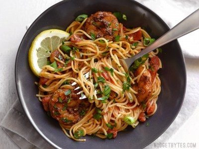 Blackened shrimp pasta served with a fork.