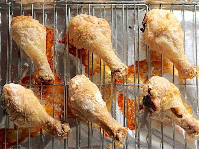 Golden Baked Chicken Drumsticks on the baking sheet