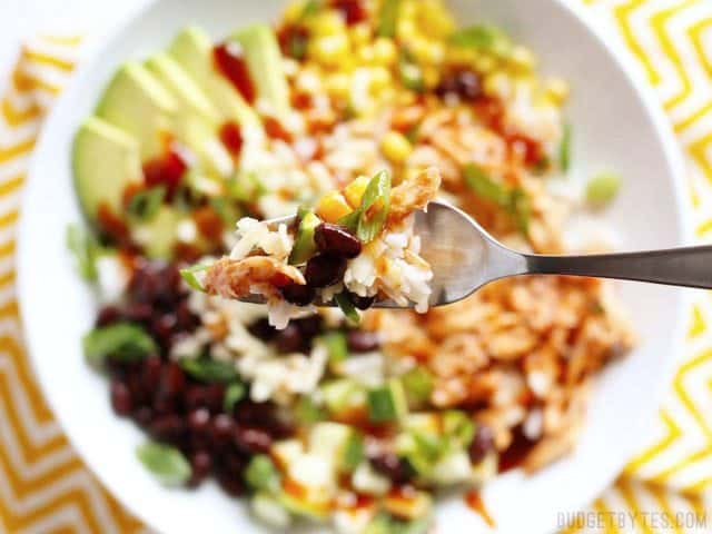 Close up of a forkful of a BBQ Chicken Burrito Bowl