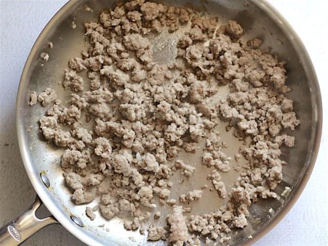 Cooked ground pork in a skillet